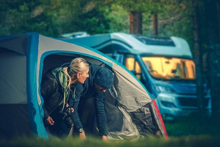 Couple Camping In Small Tent