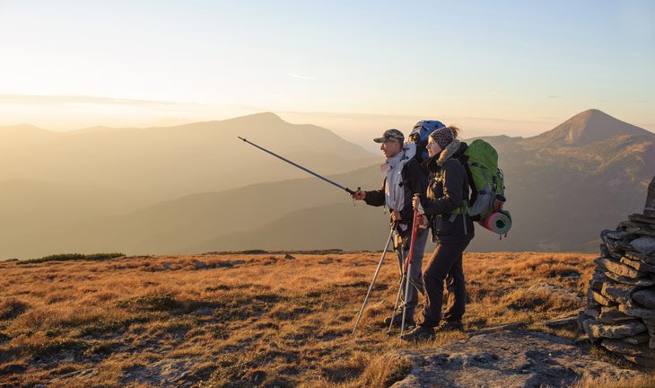 A Couple Trekking In The Mountains