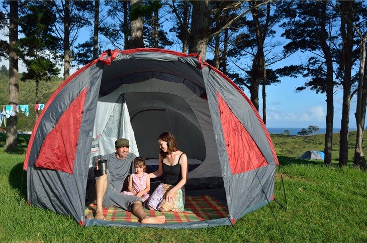 Family Camping In A Tent Outdoors
