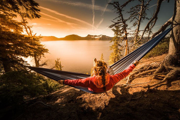 Woman Hiker Relaxing In Hammock At Crater Lake National Park Oregon